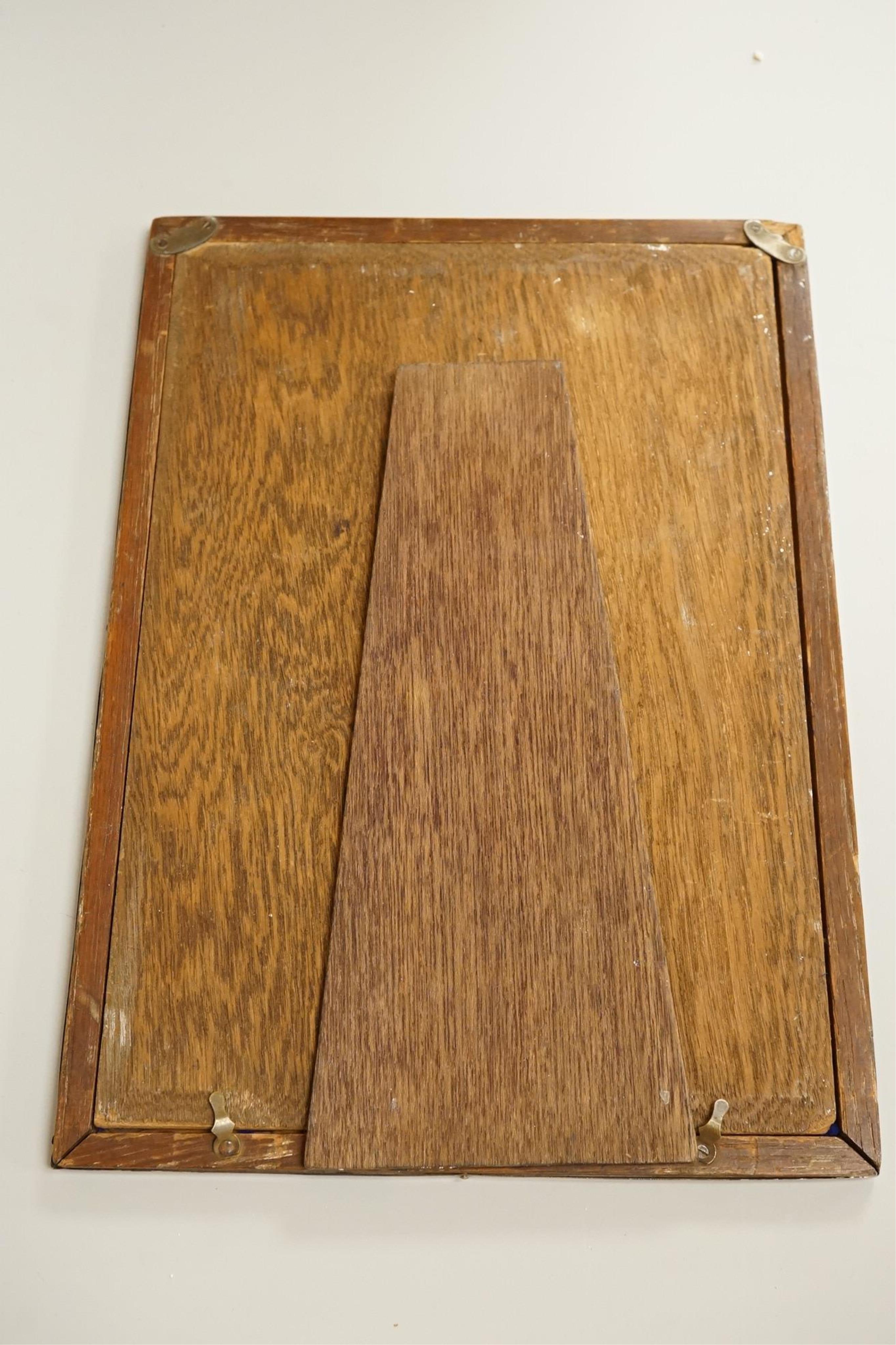 Four assorted early 20th century silver mounted photograph frames, the largest by Sanders & Mackenzie, Birmingham, 1915, 30.3cm by 21.6cm, together with two small Spanish white metal mounted photograph frames.